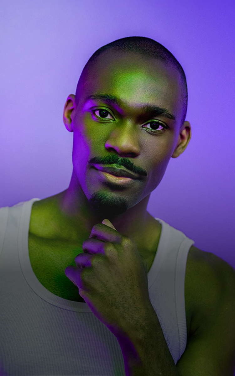 Background image of a black man wearing a white tank top against a purple background. Not an actual patient.