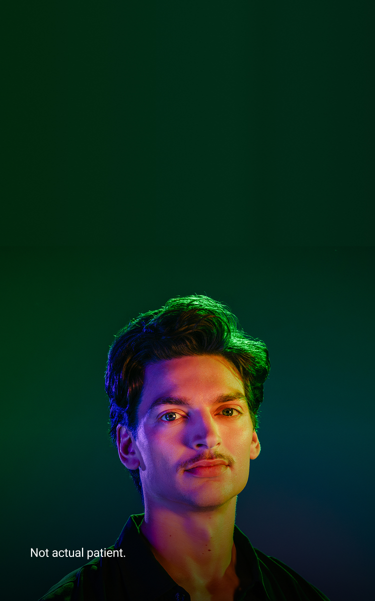 Banner image of a young Caucasian male with brown hair and a mustache. Not an actual patient.
