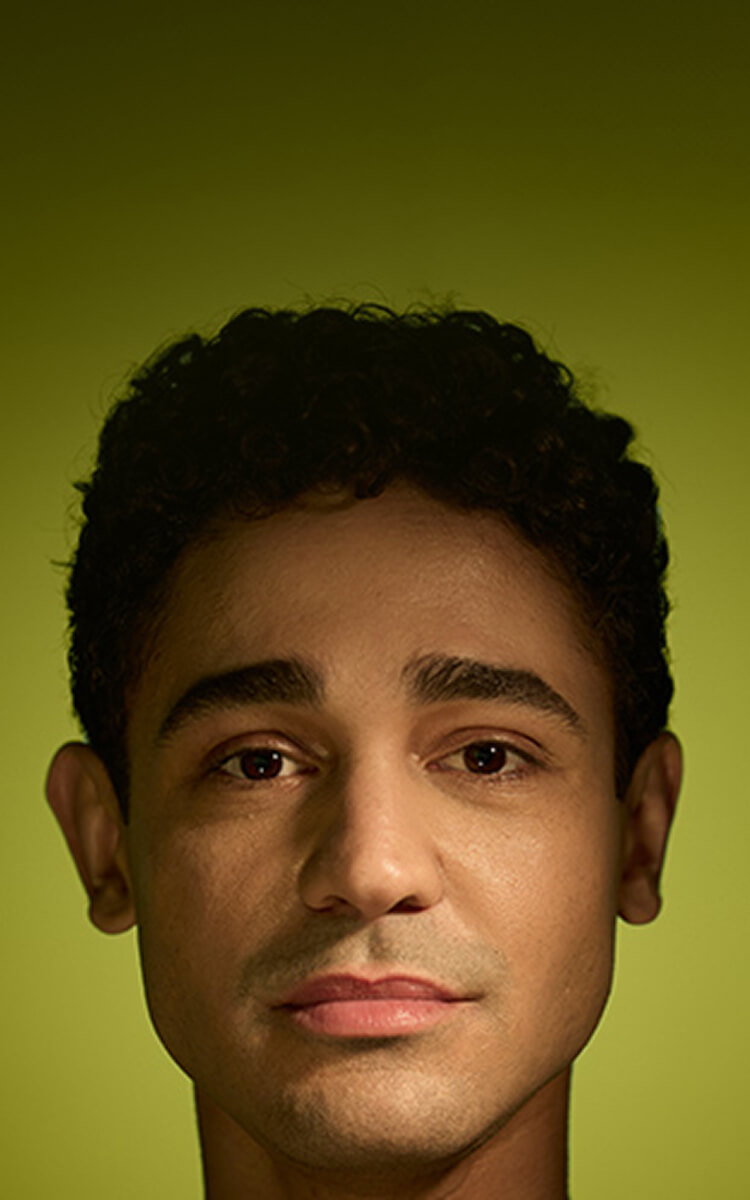 Banner image of a Latino male on a green background.